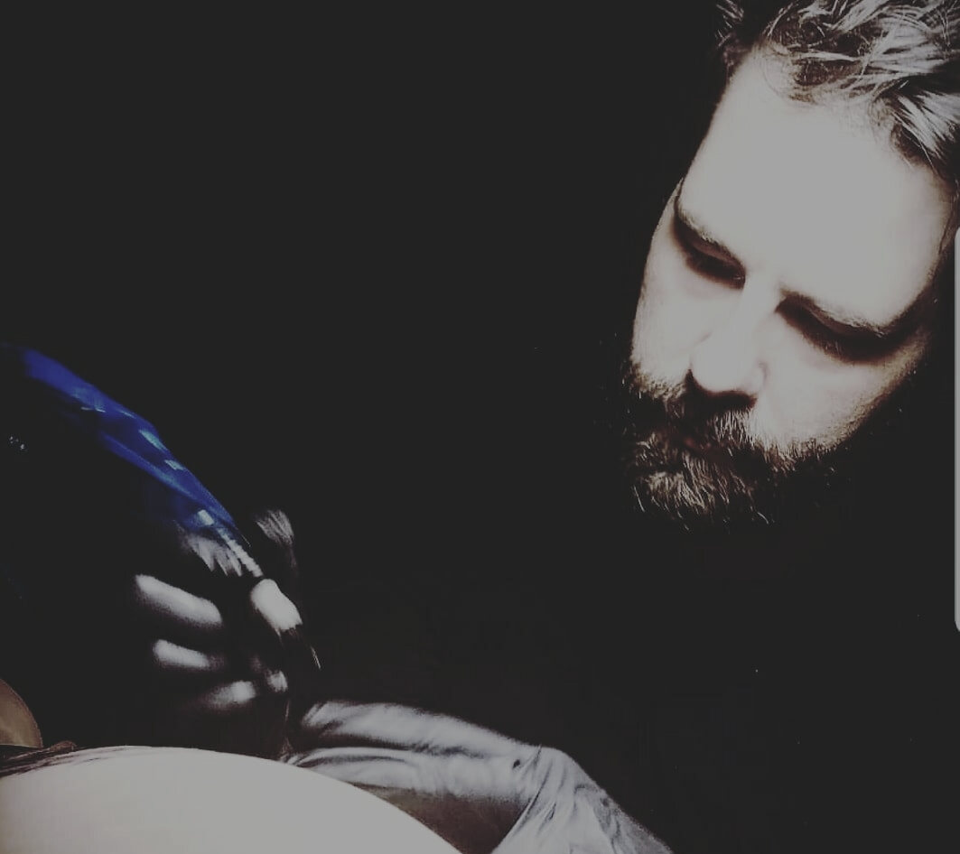 Ray at work in the Black Diamond Tattoo studio