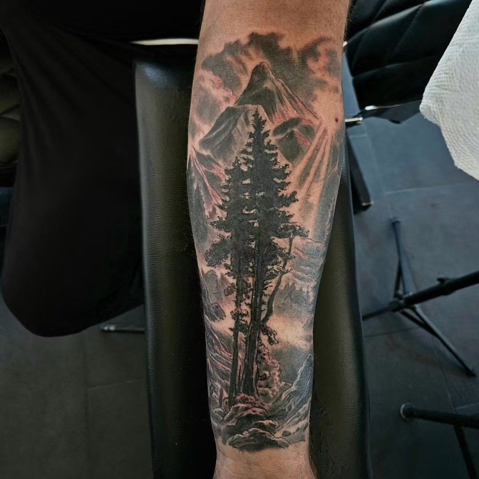 Mountain landscape tattoo after cover-up